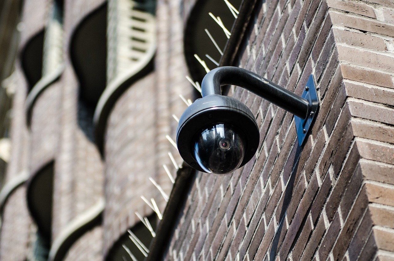 CCTV camera installed on brick wall
