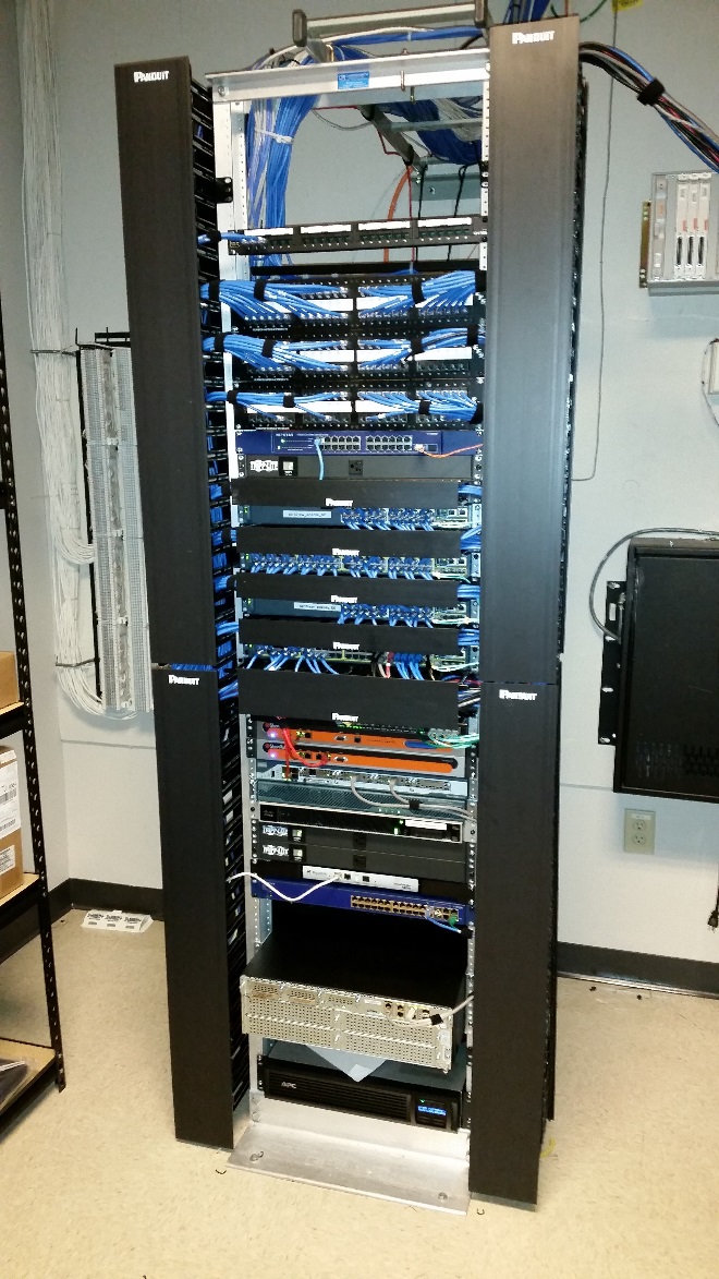 Professional network rack installation with Panduit and APC equipment