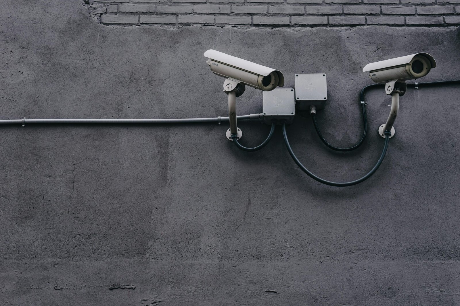 Two Bosch CCTV cameras on commercial building